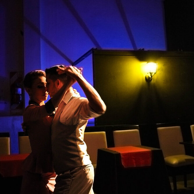 Dancers embraced in the art of tango. 